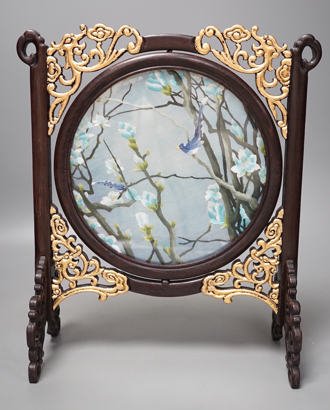 A Chinese wood and embroidered silk table screen. 33cm